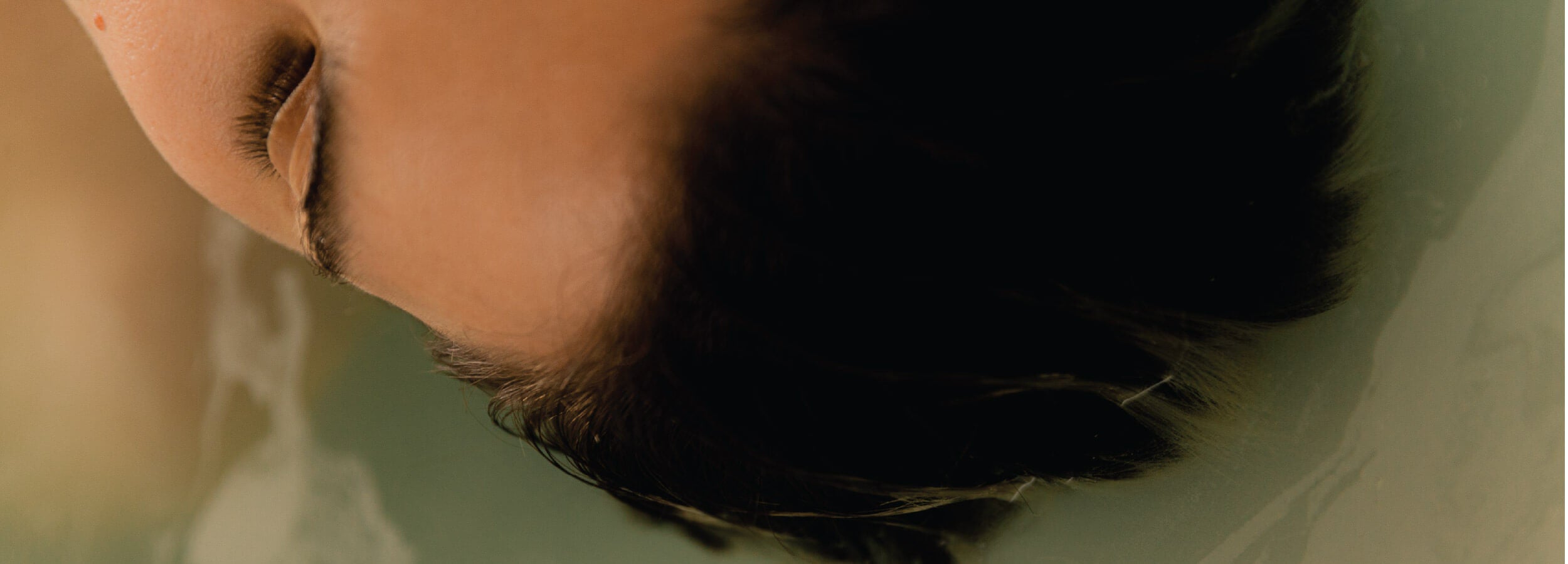 Close-up of a person's face with a blurred background
